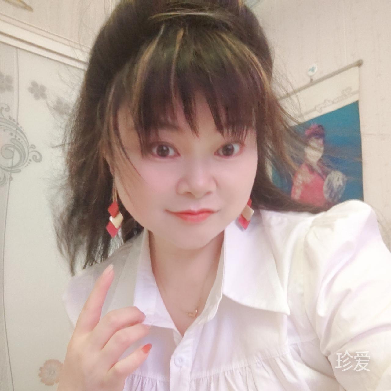 嫣然